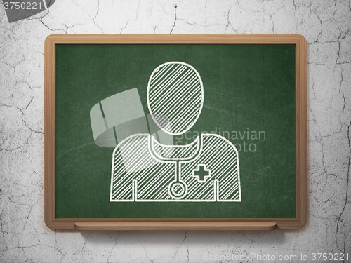 Image of Medicine concept: Doctor on chalkboard background