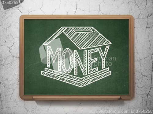 Image of Money concept: Money Box on chalkboard background