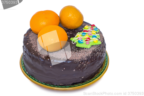 Image of Chocolate cake and oranges on a ceramic dish on white background