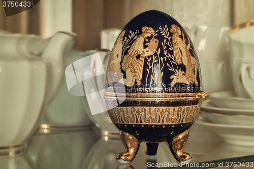 Image of Casket in the form of an Easter egg with an ornament.