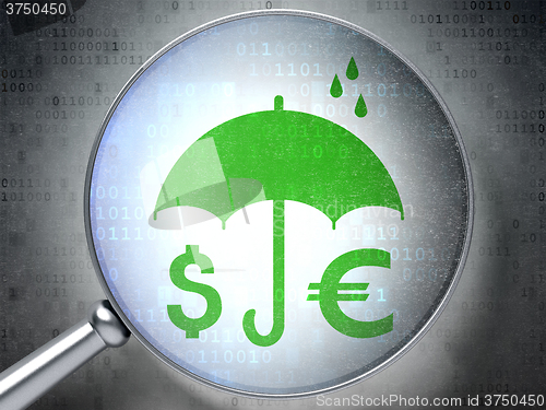 Image of Protection concept: Money And Umbrella with optical glass on digital background