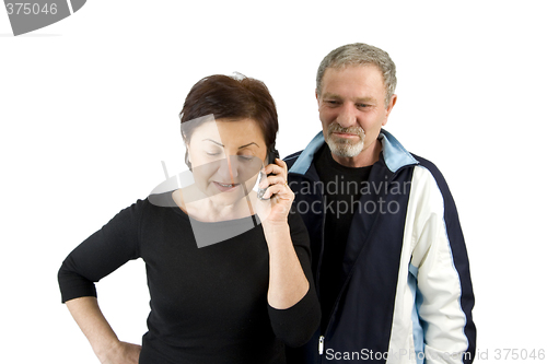 Image of Wife on the Phone while Husband Waiting for the News