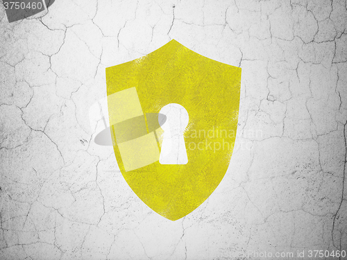Image of Protection concept: Shield With Keyhole on wall background
