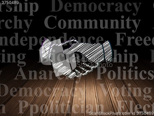 Image of Political concept: Handshake in grunge dark room