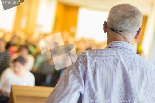 Image of Speaker at Business Conference and Presentation.