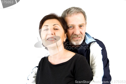 Image of Couple Hugging while Looking At the Camera