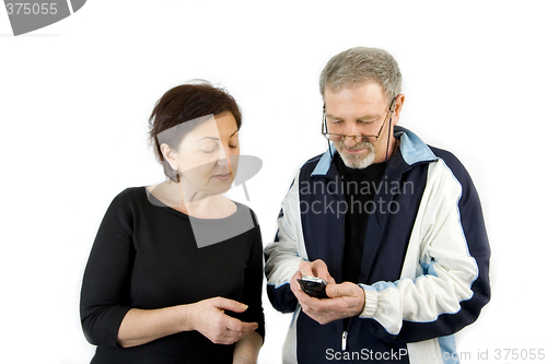 Image of Couple checking the Text Message on the Phone