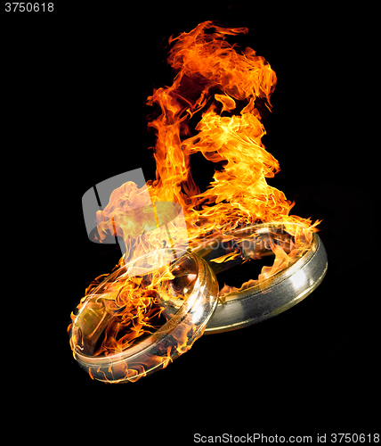 Image of burning wedding rings