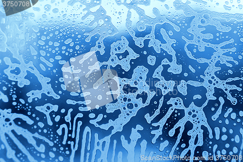 Image of Foam abstract pattern on the glass