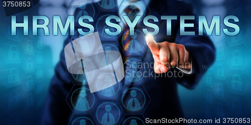 Image of HR Manager Pushing HRMS SYSTEMS Onscreen 