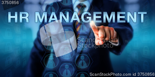 Image of Recruiter Pressing HR MANAGEMENT Onscreen