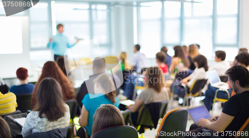 Image of Speaker at Business convention and Presentation.