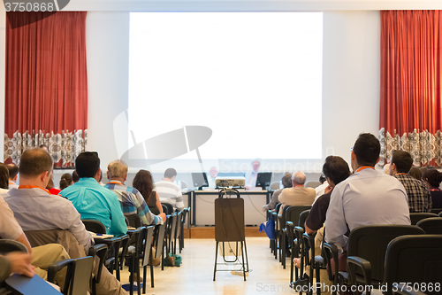 Image of Speaker at Business Conference and Presentation.