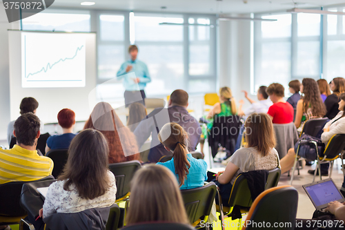 Image of Speaker at Business convention and Presentation.