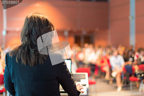 Image of Business woman lecturing at Conference.