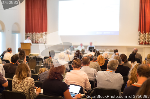 Image of Speaker at Business Conference and Presentation.