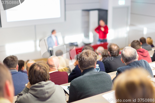 Image of Speaker at Business Conference and Presentation.