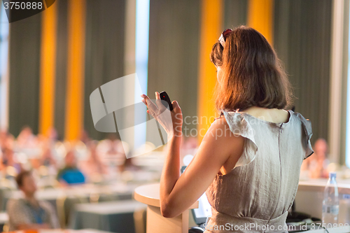 Image of Speaker at Business Conference and Presentation.