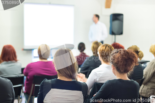 Image of Speaker at Business convention and Presentation.