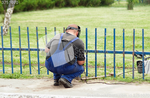 Image of working welder