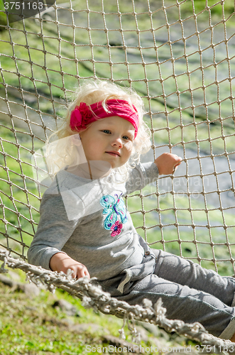 Image of Girl swinging in a hammock