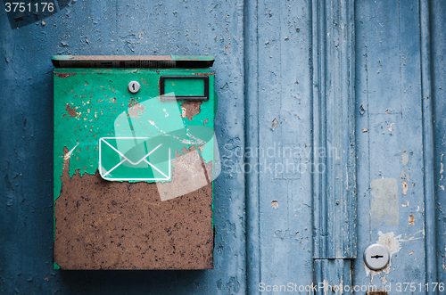 Image of Old mailbox on a building wall, close-up  