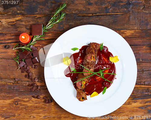 Image of Roasted meat with vegetables and chocolate sauce