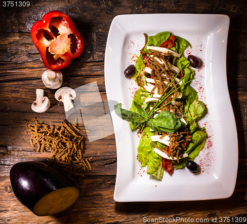 Image of aubergine,mozzarella and tomato with basil