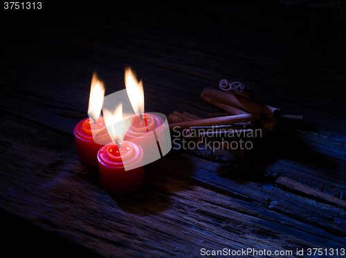 Image of Cinnamon sticks on wooden background