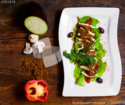 Image of aubergine,mozzarella and tomato with basil