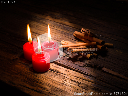 Image of Cinnamon sticks on wooden background
