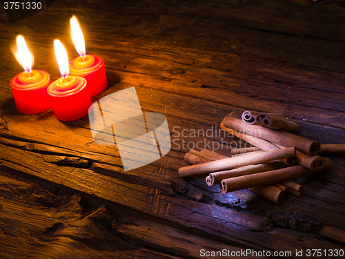 Image of Cinnamon sticks on wooden background