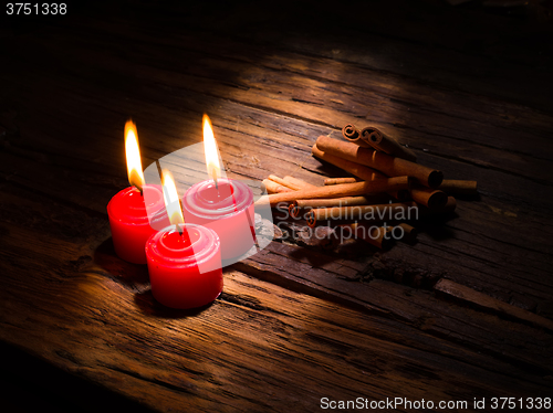 Image of Cinnamon sticks on wooden background