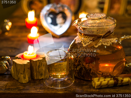 Image of The exotic green tea with flowers in glass teapot 