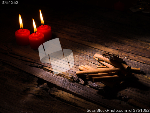 Image of Cinnamon sticks on wooden background