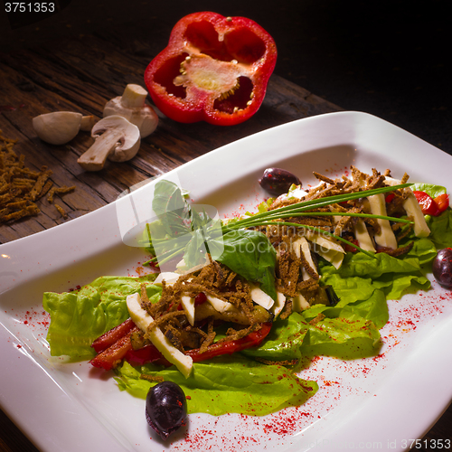 Image of Salad from aubergine,mozzarella and tomato with basil. 