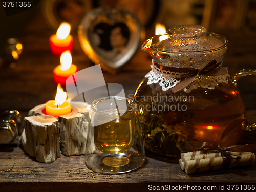 Image of The exotic green tea with flowers in glass teapot 