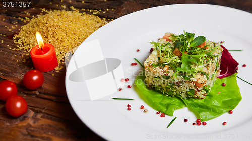 Image of Salad with bulgur, parsley and vegetables.
