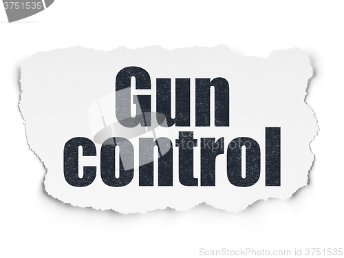 Image of Safety concept: Gun Control on Torn Paper background