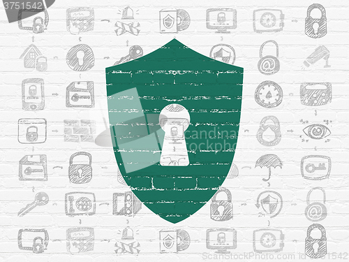 Image of Protection concept: Shield With Keyhole on wall background