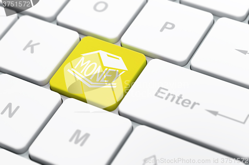 Image of Currency concept: Money Box on computer keyboard background