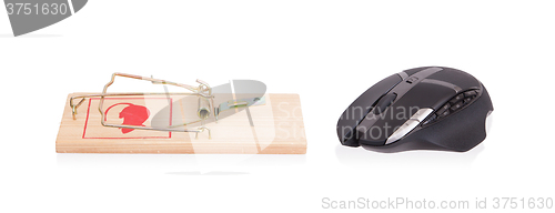 Image of Modern computer mouse in a mousetrap