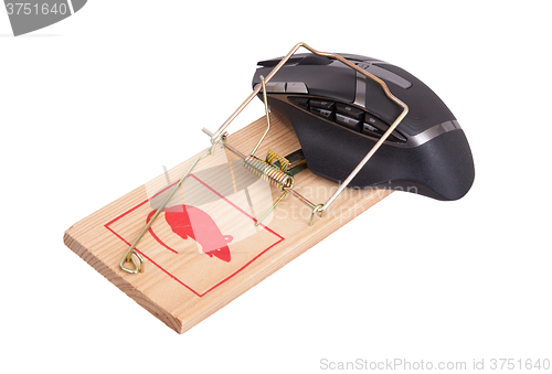 Image of Modern computer mouse in a mousetrap