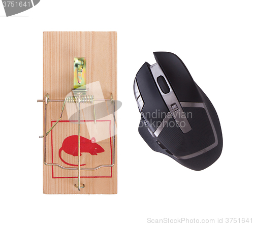 Image of Modern computer mouse in a mousetrap