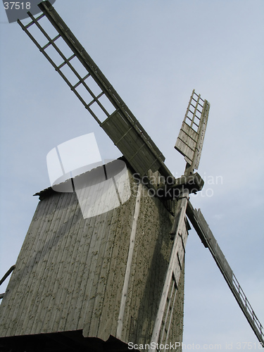 Image of old windmil on blue background