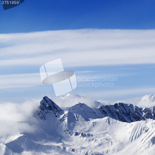 Image of Snowy mountains in haze