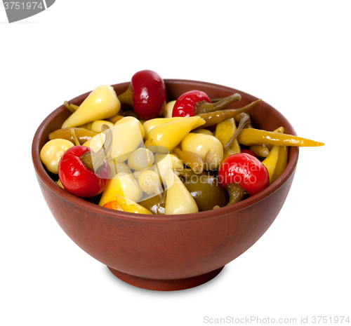 Image of Mix of hot turkish marinated peppers in ceramic bowl