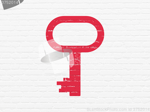 Image of Protection concept: Key on wall background