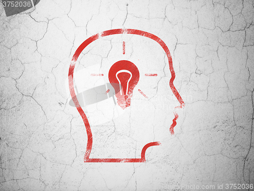 Image of Education concept: Head With Lightbulb on wall background