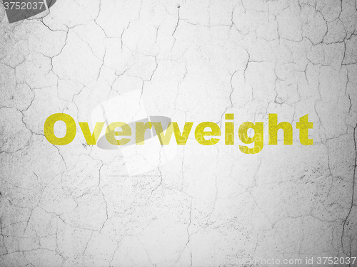 Image of Health concept: Overweight on wall background